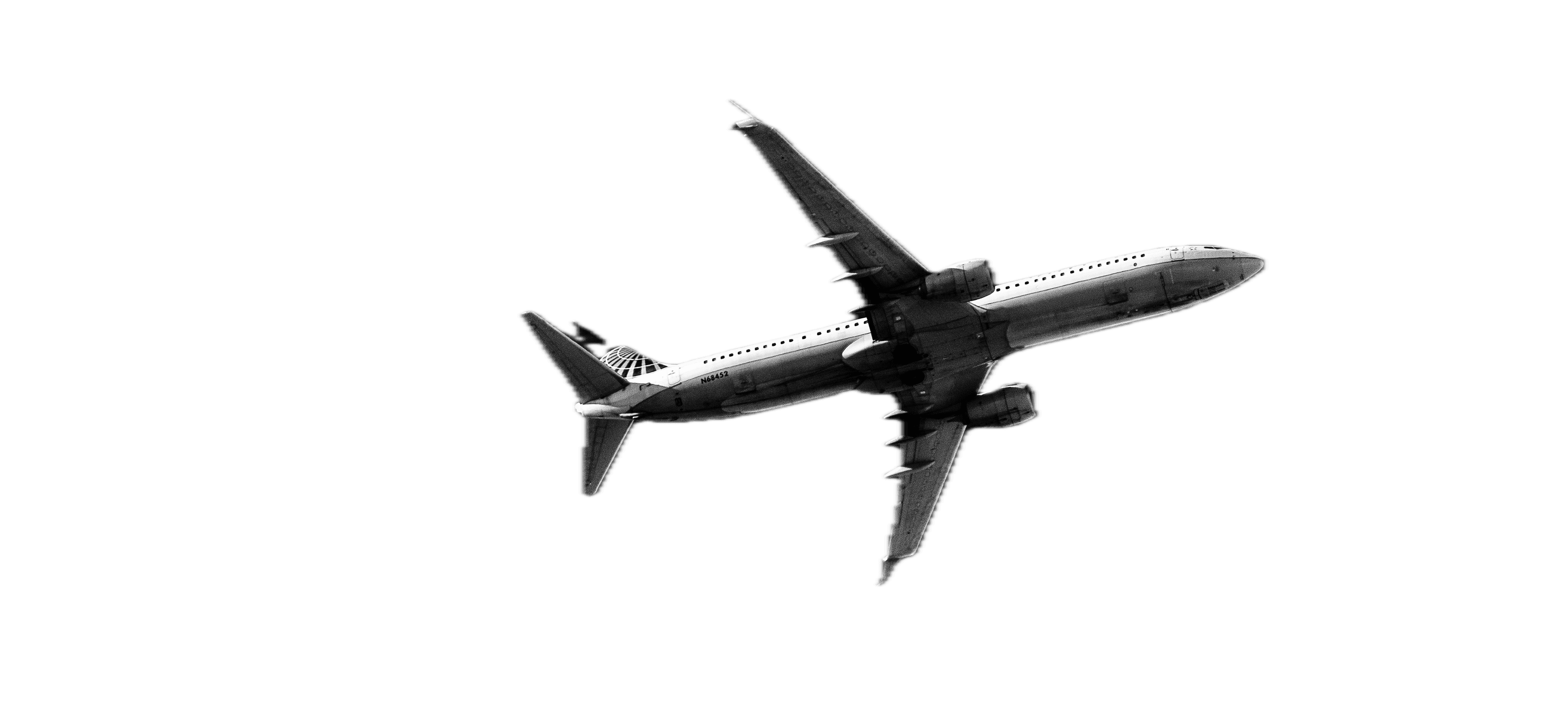 Aircraft in flight over a night operations backdrop